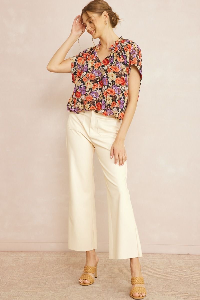 BROWN AND PINK FLORAL TOP WITH WAIST DETAIL paired with white dress pants for a trendy coastal style from Raggdoll Boutique.