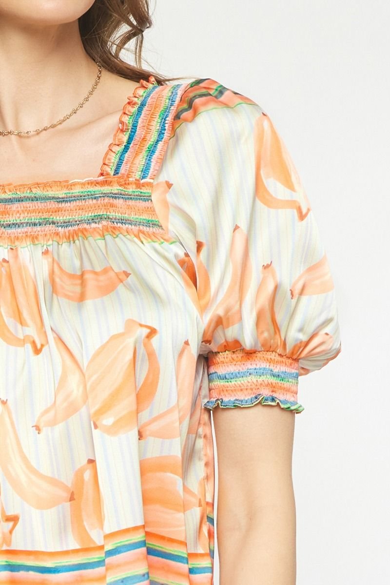 ORANGE MULTI TOP featuring a colorful design, ideal for trendy coastal style from Raggdoll Boutique.