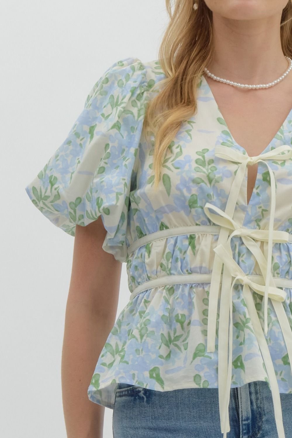 Blue floral print tie-front top from a coastal boutique, perfect for tropical vacation dresses and curvy plus size fashion.