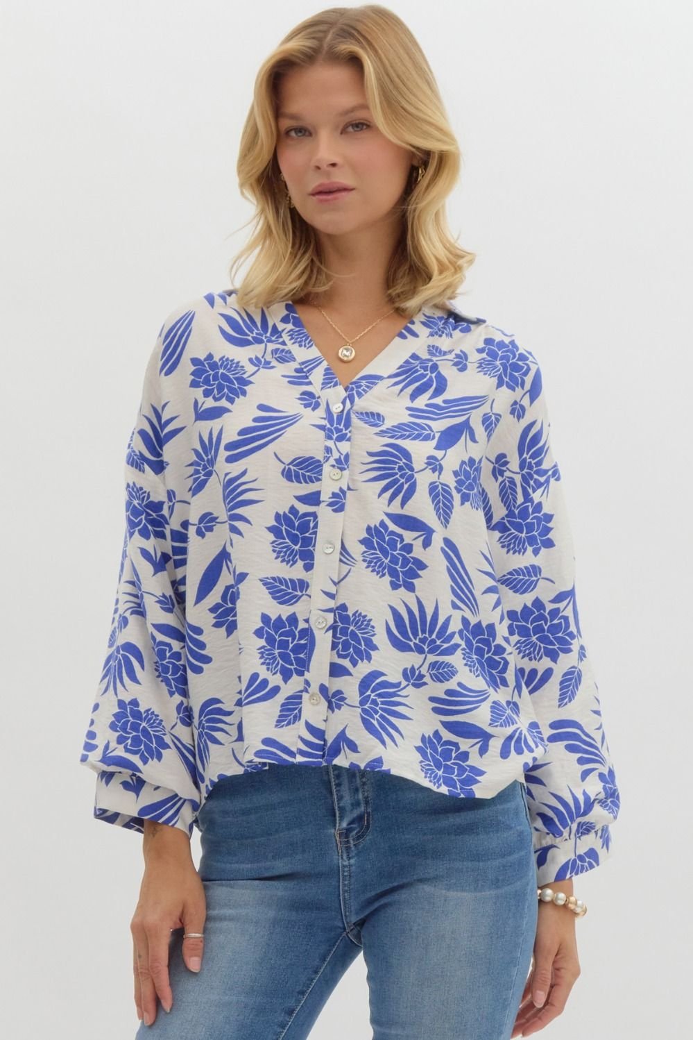 Royal blue and cream button-down top in floral print, perfect for coastal boutique clothing and tropical vacation dresses.