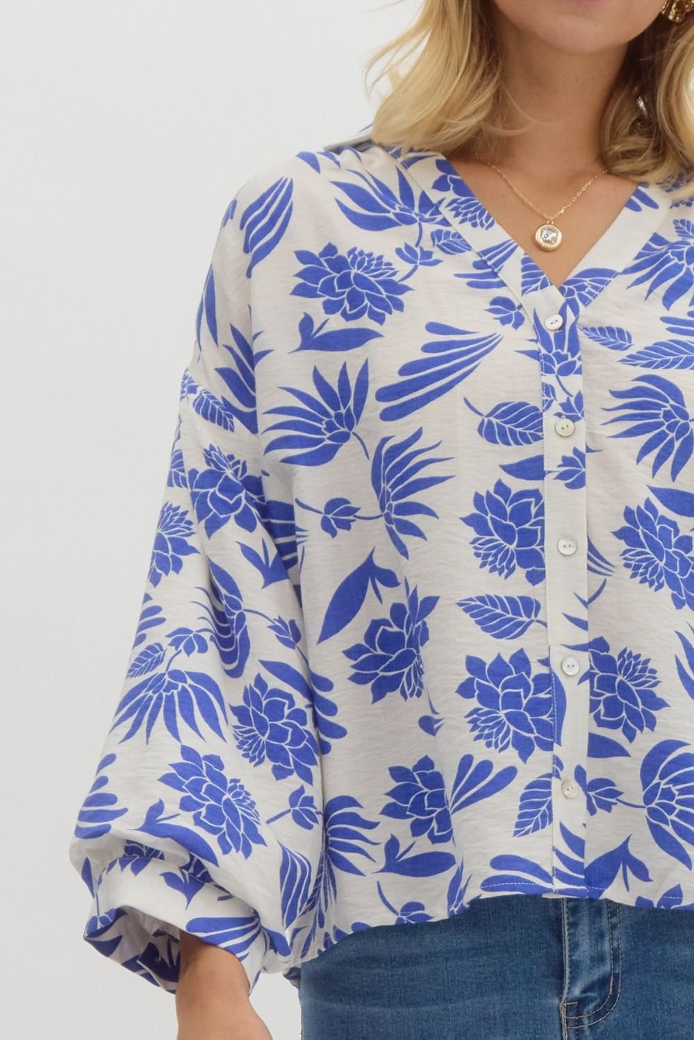 Royal blue and cream floral button-down top from a Port Aransas boutique, perfect for coastal fashion and tropical vacations.