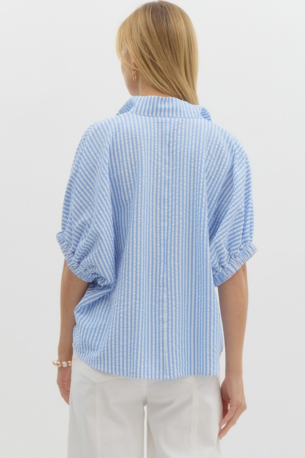 Back view of a fresh blue and white striped top with Kelly green detail, perfect for coastal boutique clothing and tropical vacations.