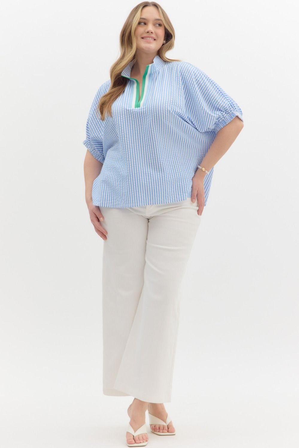 Plus-size blue and white striped top with green detail, perfect for coastal boutique clothing and casual chic looks.
