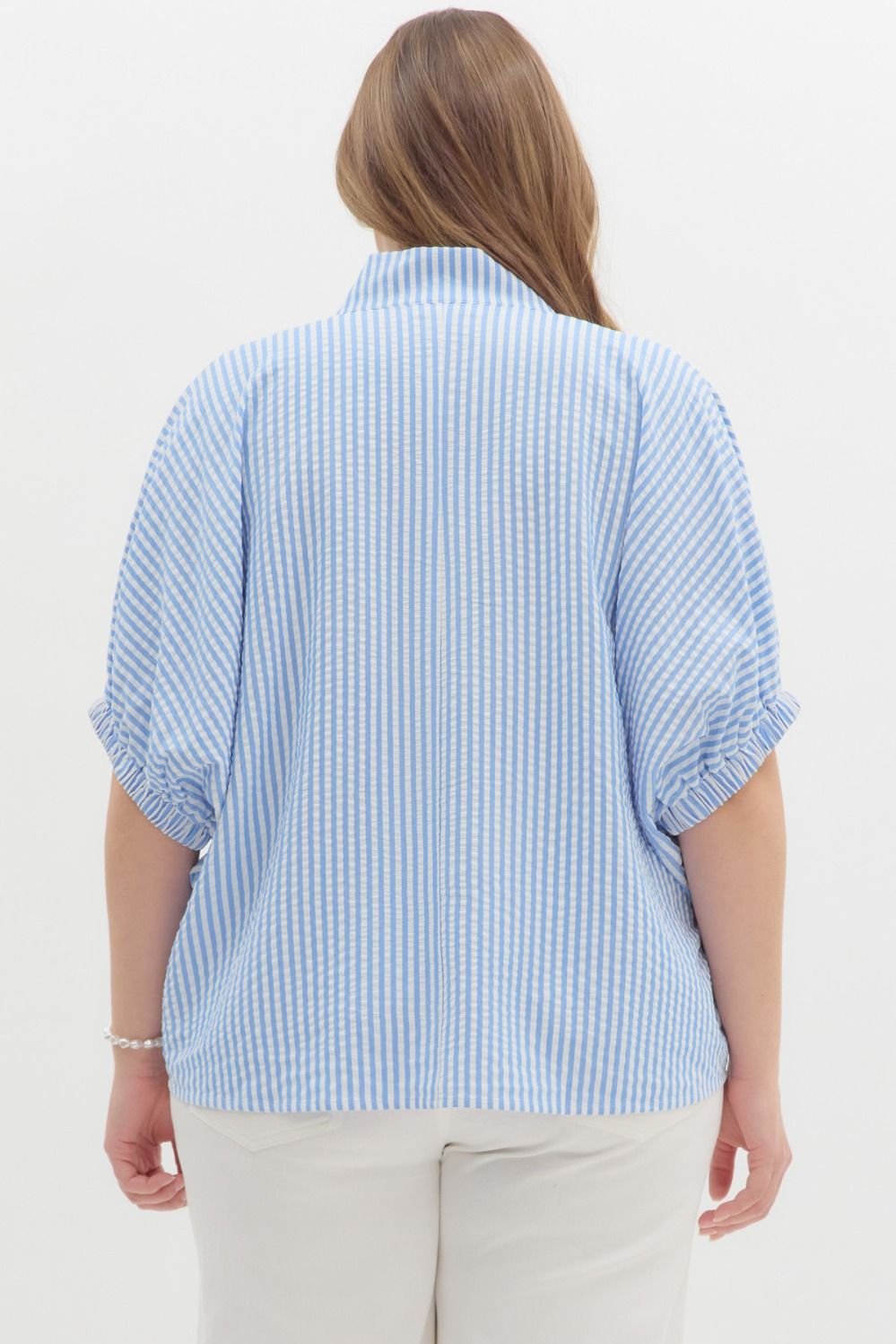 Plus-size blue and white striped top with green detail, perfect for coastal boutique clothing and casual chic style.