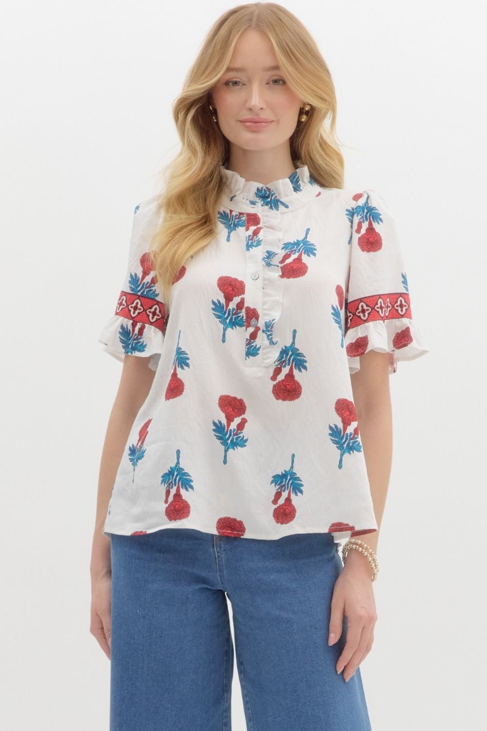 Floral print banded sleeve top, a stylish addition to coastal boutique clothing and perfect for casual outings.