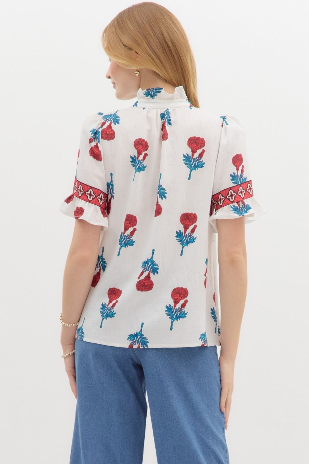 Floral print banded sleeve top, perfect for casual wear. Ideal coastal boutique clothing choice for stylish women.