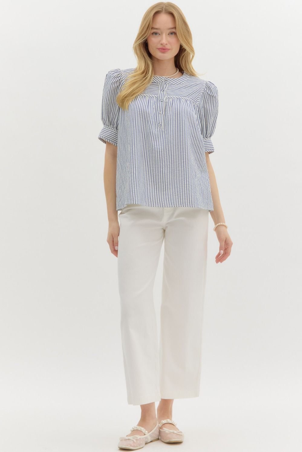 Stylish blue striped structured shoulder top for women, perfect for coastal boutique clothing and tropical vacation outfits.