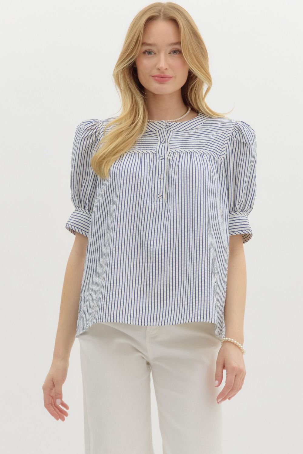 Blue striped structured shoulder short sleeve top, perfect for coastal boutique clothing and stylish tops for women.