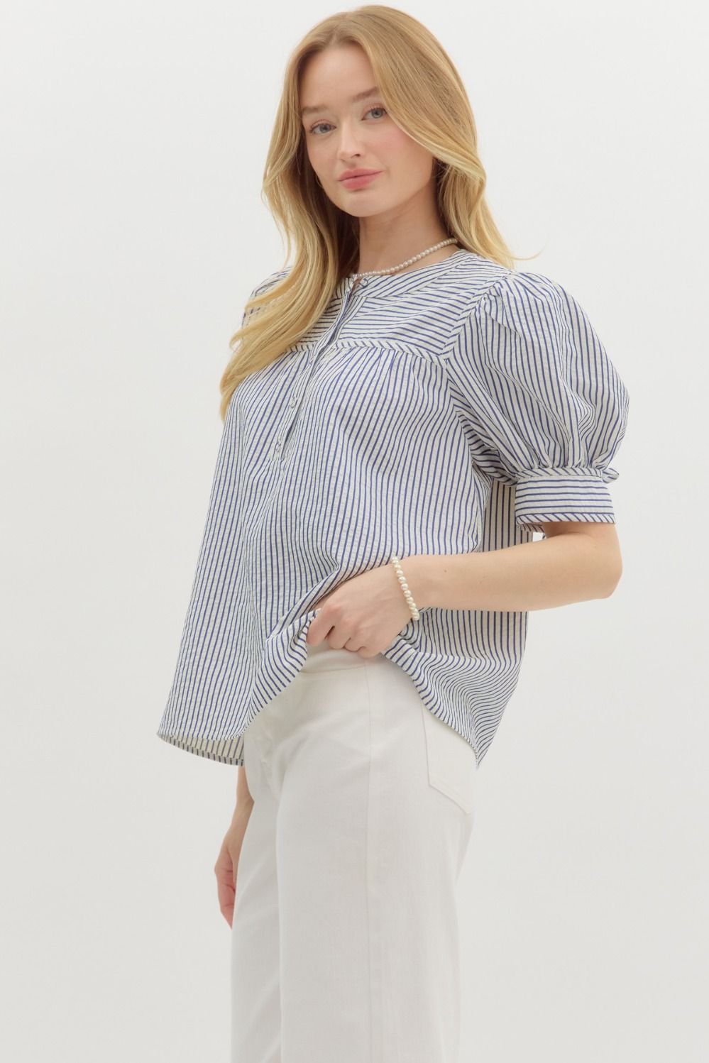 Blue striped structured shoulder short sleeve top, perfect for coastal boutique clothing and summer casual wear.
