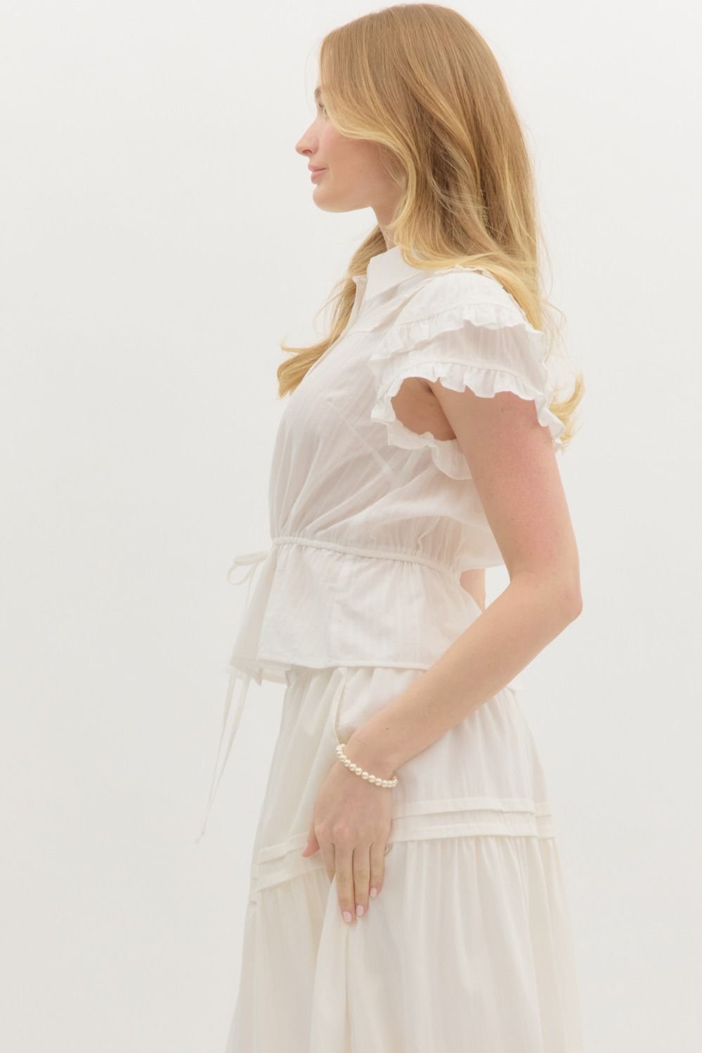 Ivory Dream Top with flutter sleeves and adjustable waist tie, ideal for coastal boutique clothing and stylish women's fashion.