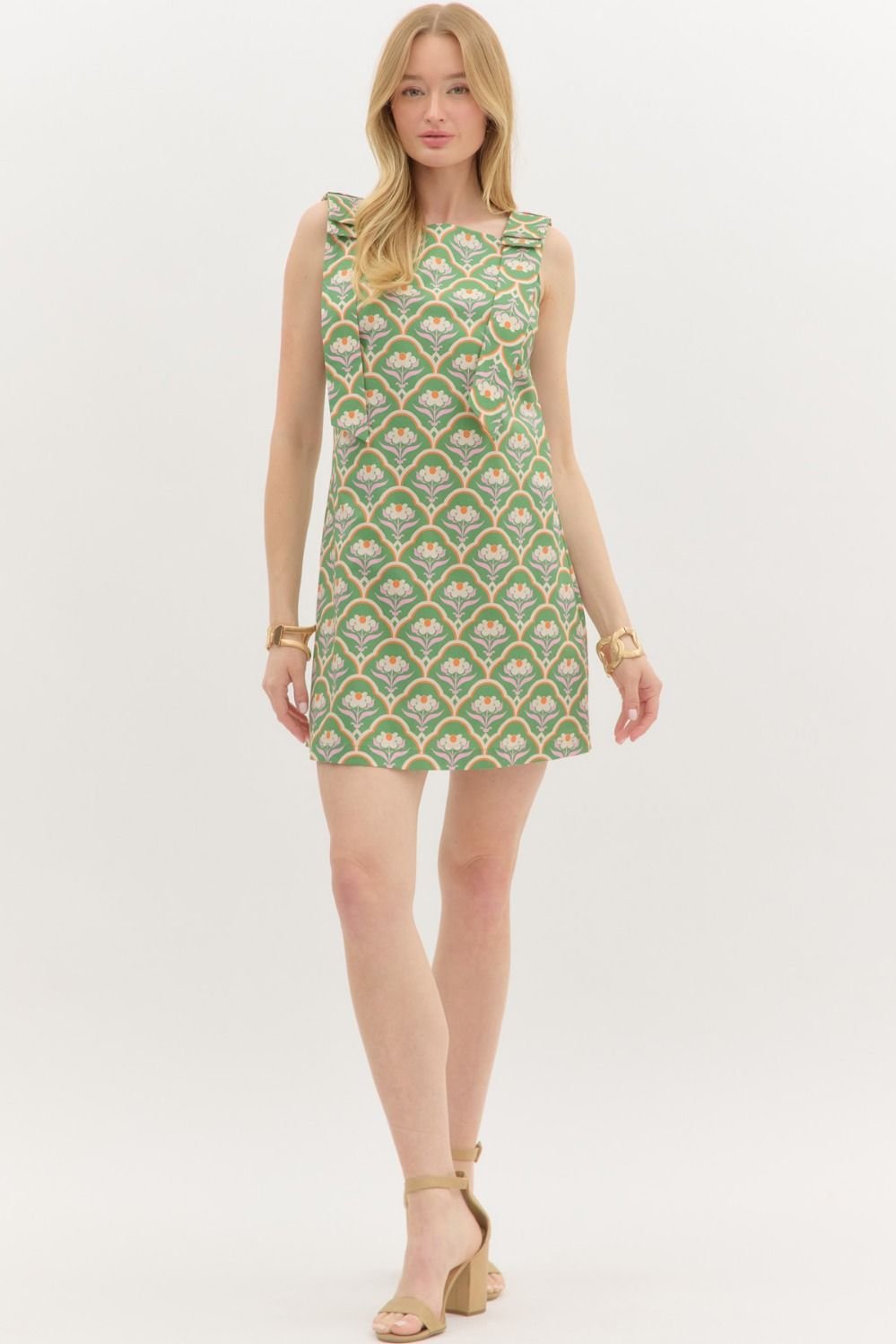 Charming green mini dress with floral scallop design, perfect for coastal boutique clothing and beach outings.