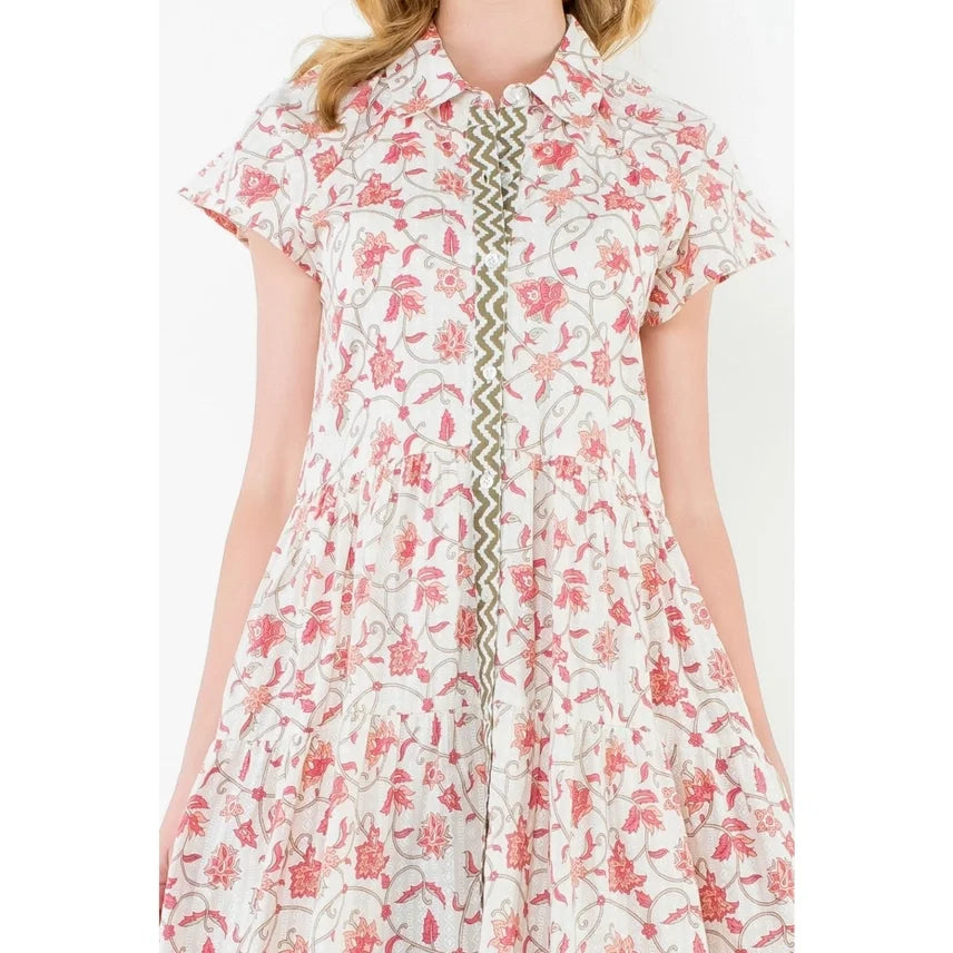 Cream floral button-up dress from coastal boutique clothing, perfect for trendy summer outings and beach vacations.