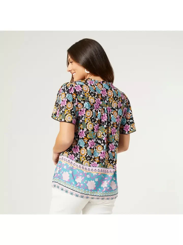 Back view of COCO + CARMEN CORDELIA FLORAL TOP, featuring colorful floral design, perfect for summer outfits Texas.