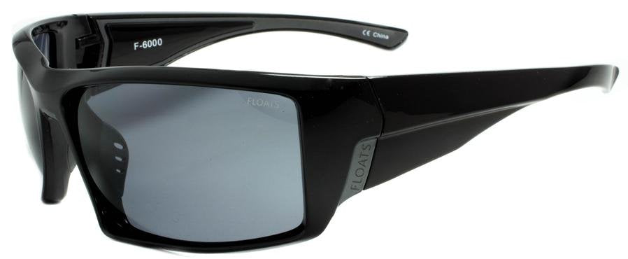 FLOATS Glossy Black sunglasses with a wrap around frame and floating technology, perfect for coastal fashion excursions.