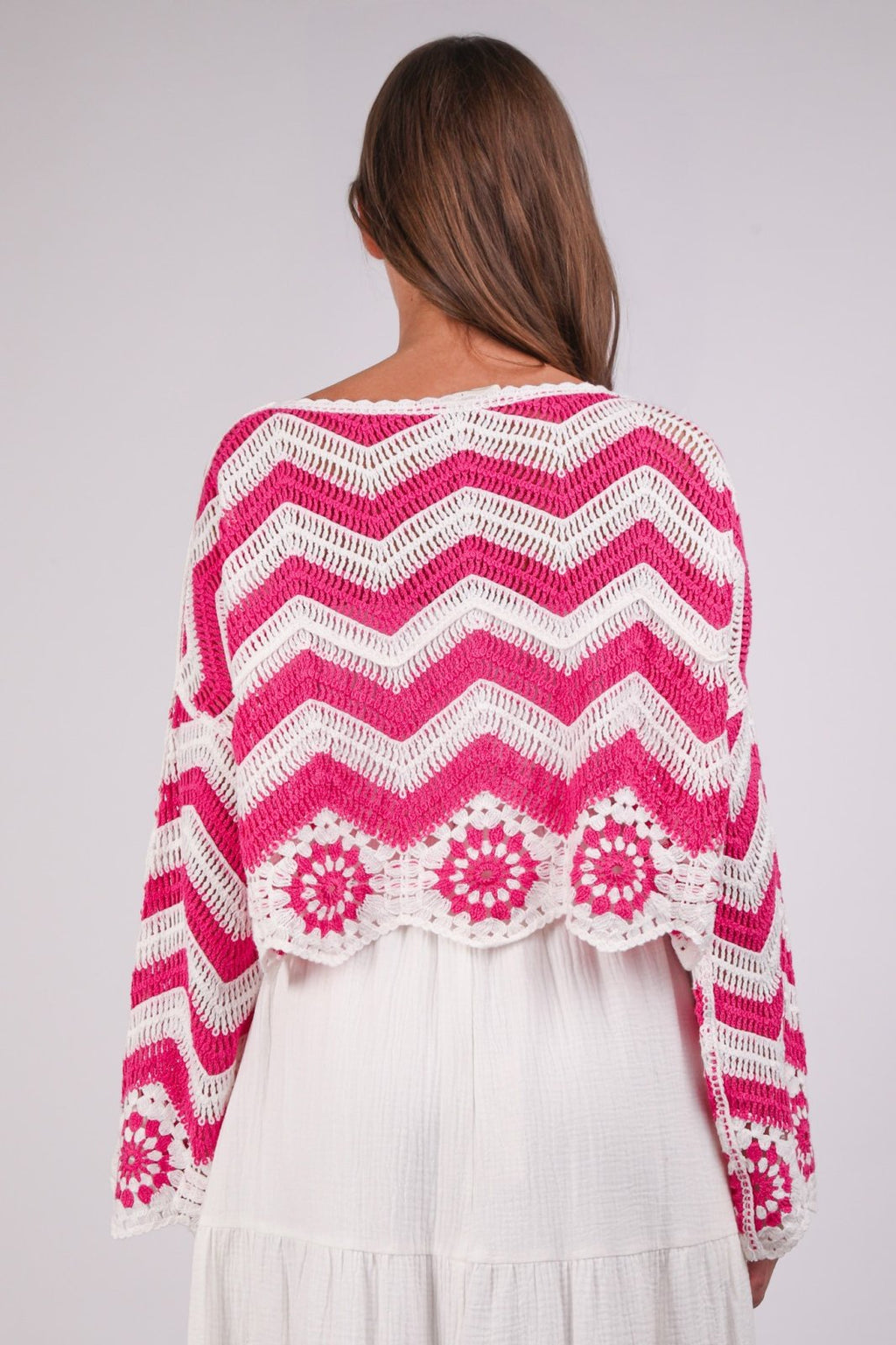 Back view of a pink chevron crochet knit top, perfect for coastal boutique clothing and beach dresses.