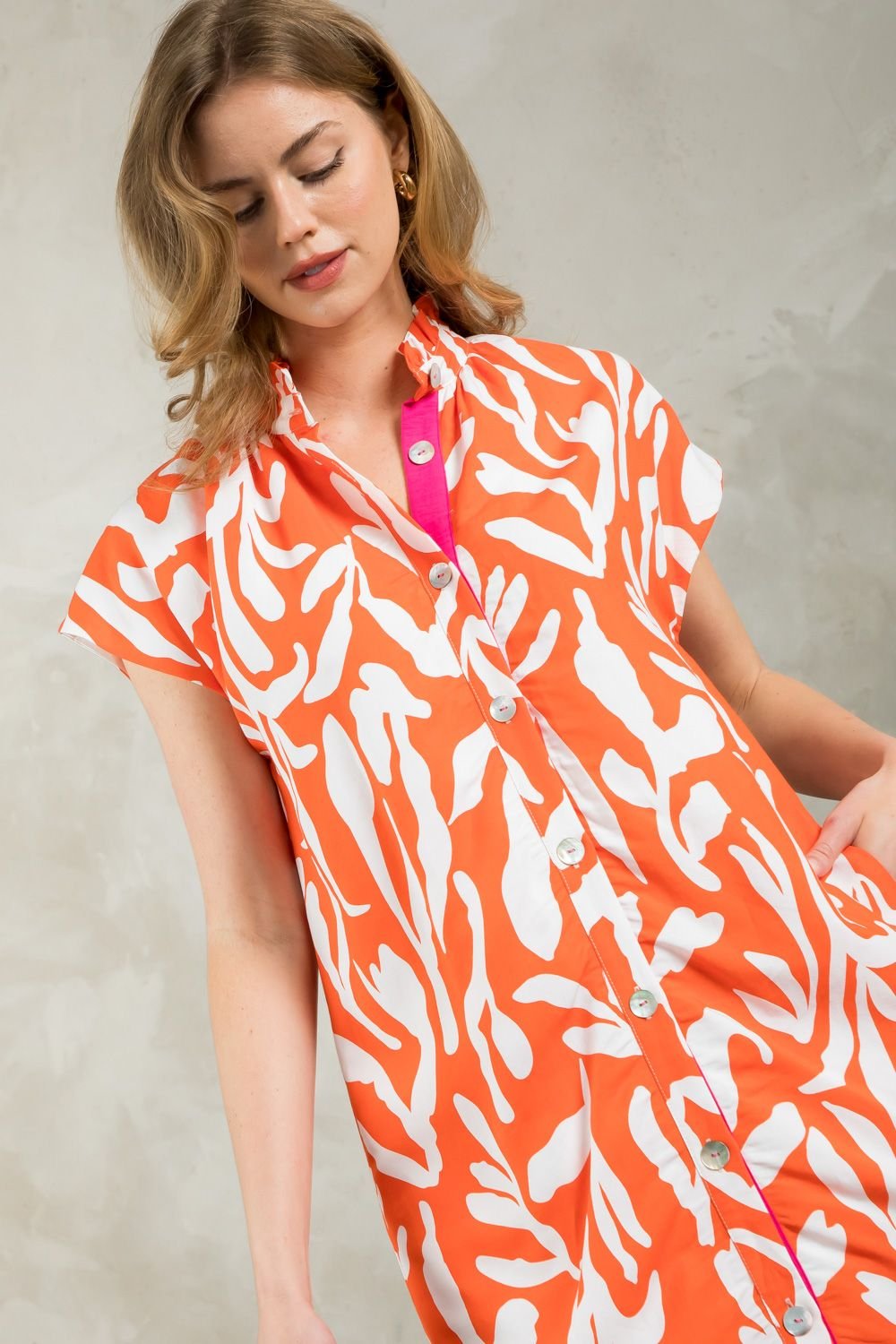 Model wearing THML Orange You Wonderful Dress, perfect for vacation wardrobe boutique at Raggdoll Boutique.