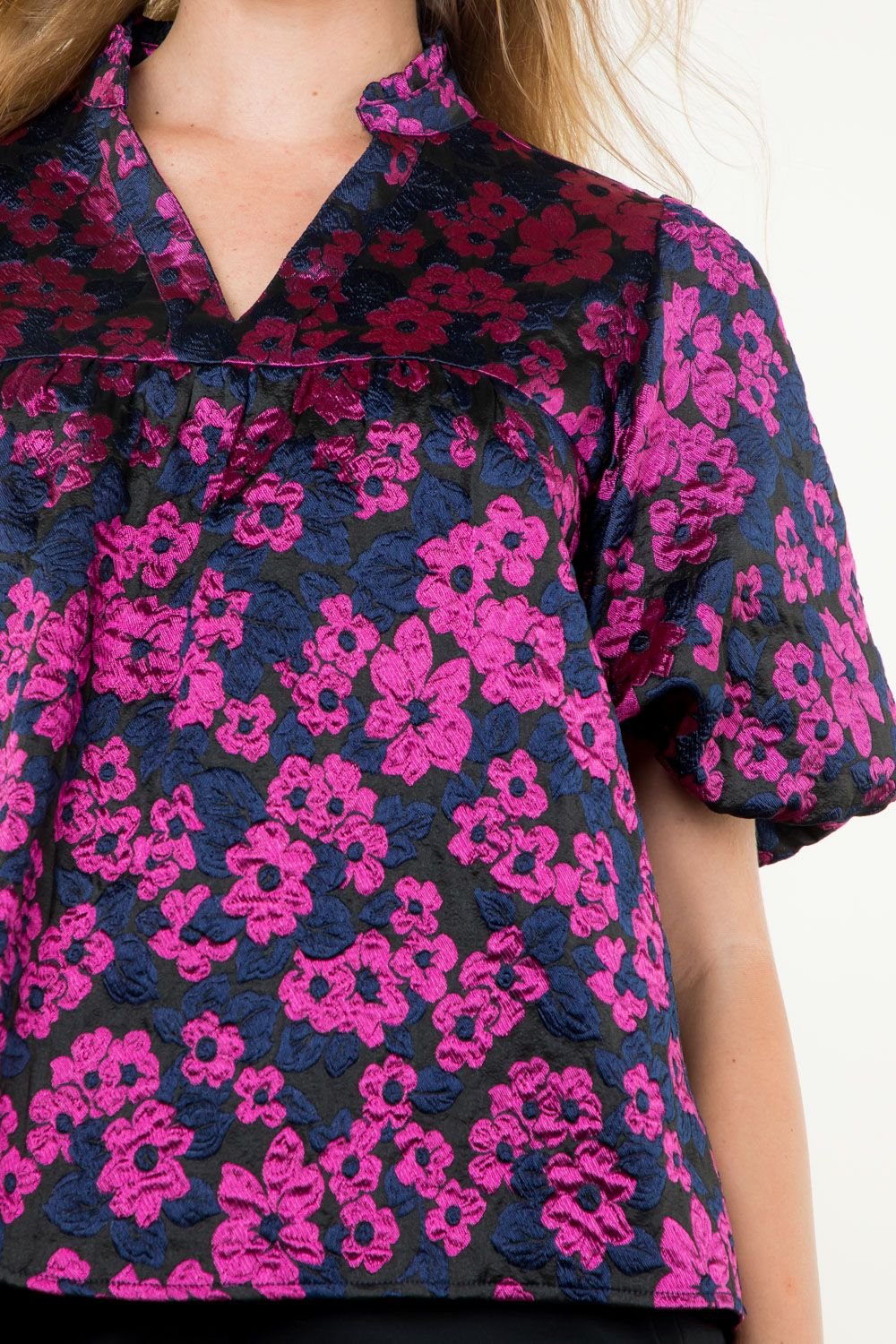 Puff sleeve navy and fuchsia flower pattern top from a Port Aransas boutique, perfect for coastal outfits and tropical vacations.