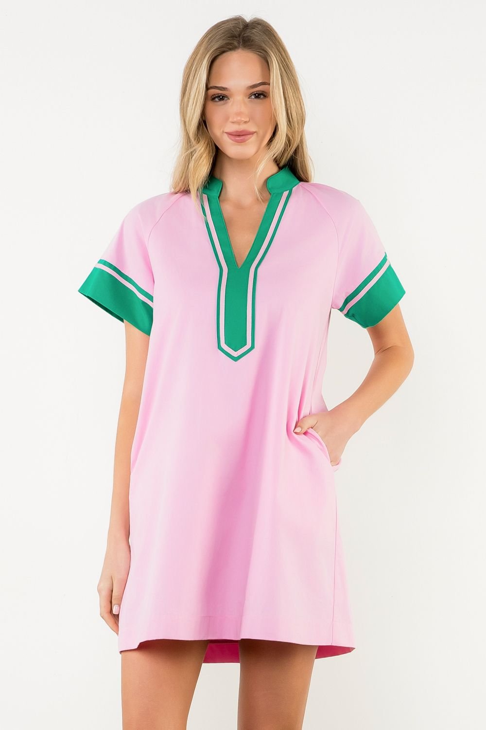 Stylish pink dress with green trim, perfect for Port Aransas beach outfits. Ideal for coastal boutique clothing lovers.