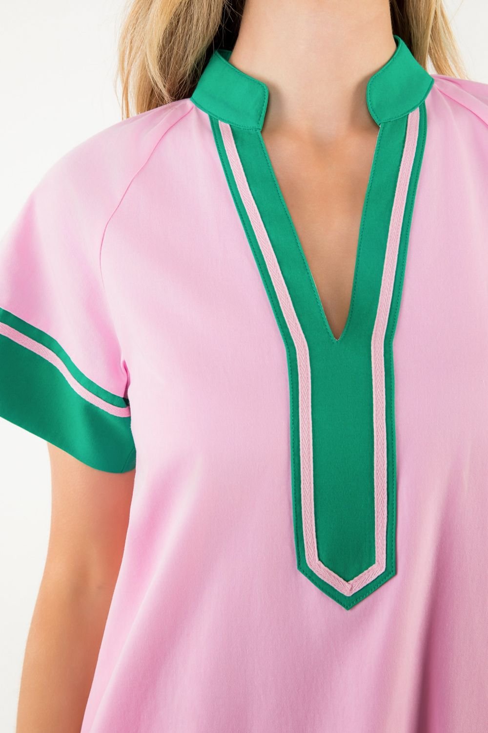 Pink dress with green trim, perfect for beach days at our Port Aransas boutique. Stylish women's fashion for summer.