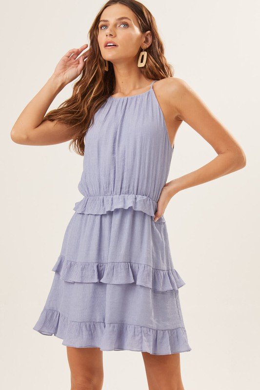 WHITECAP GREY RUFFLE DRESS model showcasing trendy coastal style at Raggdoll Boutique.