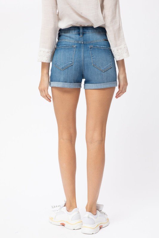 Woman wearing HAZEL DENIM SHORTS, showcasing a trendy coastal style, perfect for summer outfits Texas from Raggdoll Boutique.