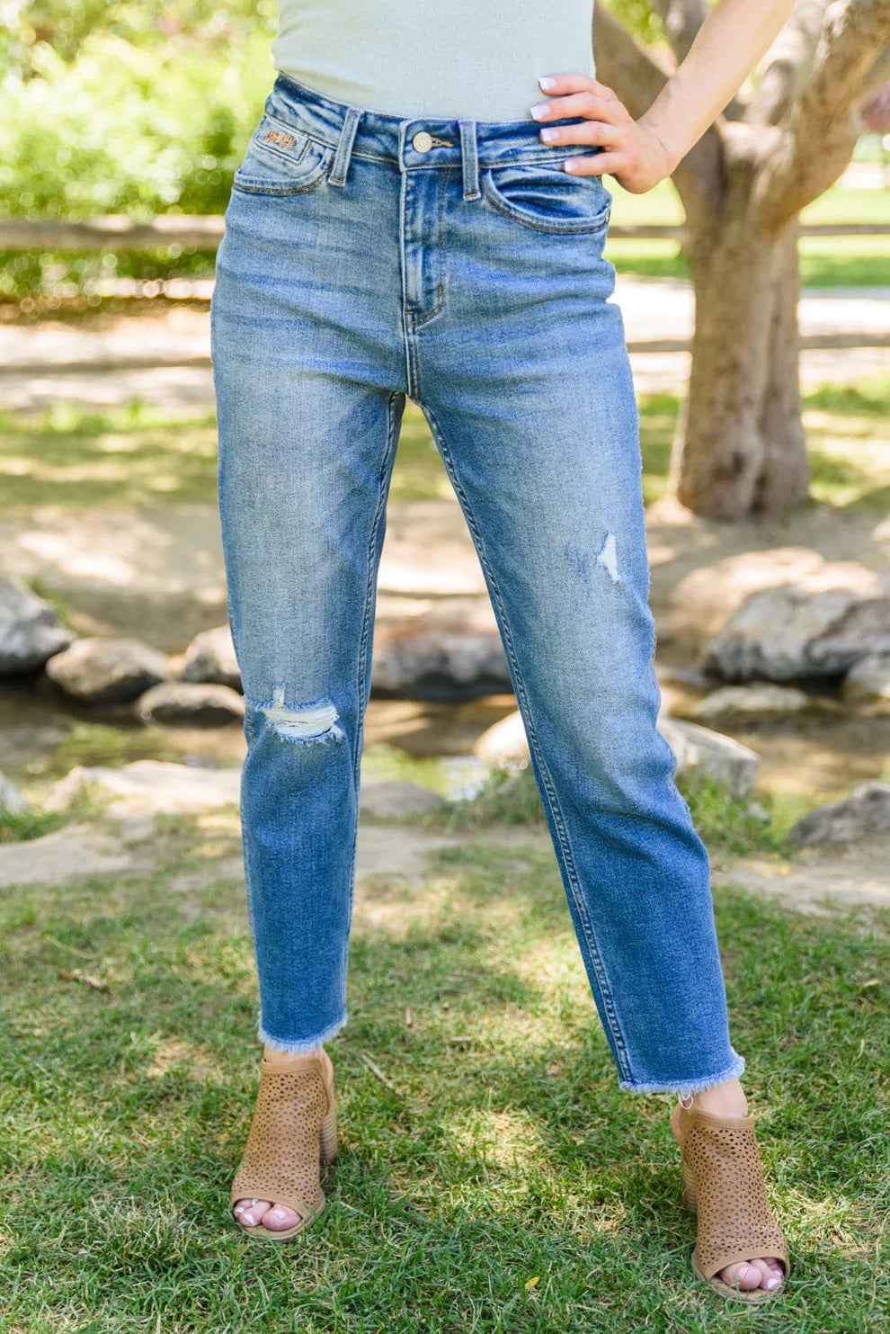JUDY BLUE HOWDY BF JEAN W/SIDE STITCH showcased in a coastal fashion setting, styled with trendy shoes and a relaxed vibe.