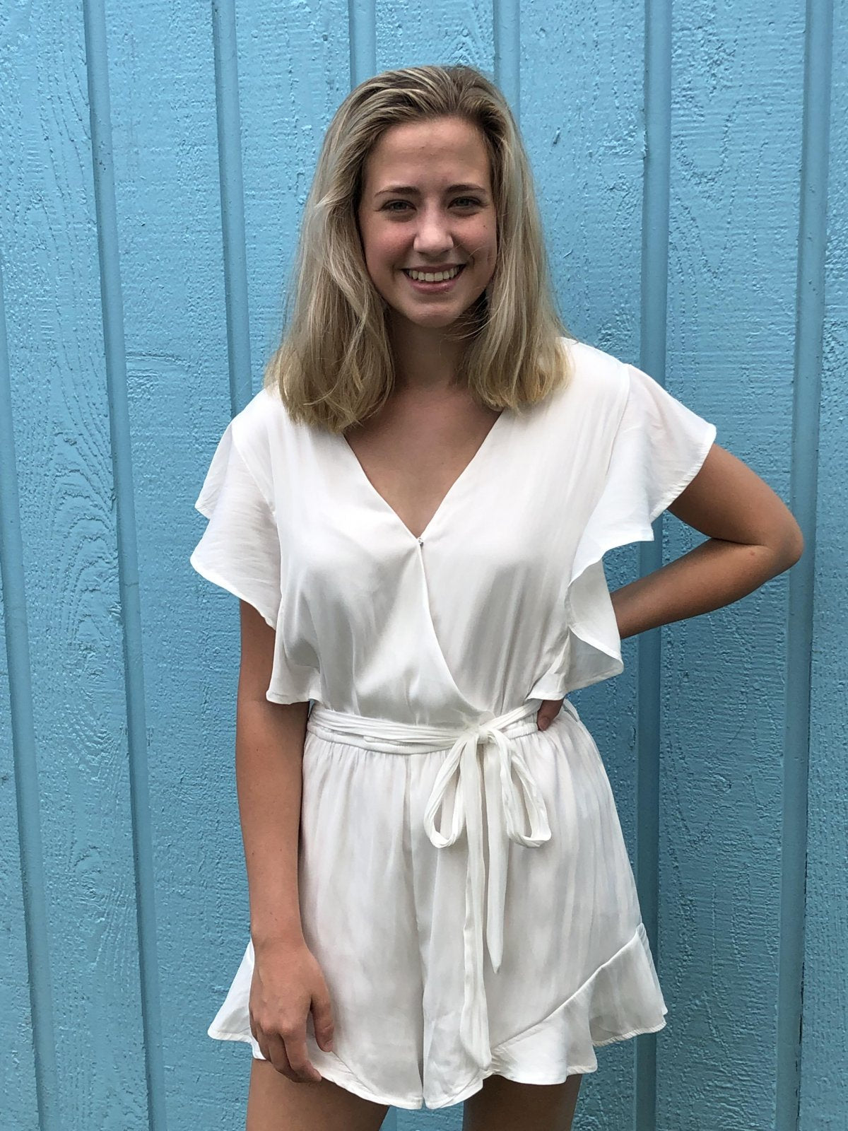 OFF WHITE FLOUNCY SLEEVE ROMPER showcased by a model, perfect for summer outfits Texas from Raggdoll Boutique.