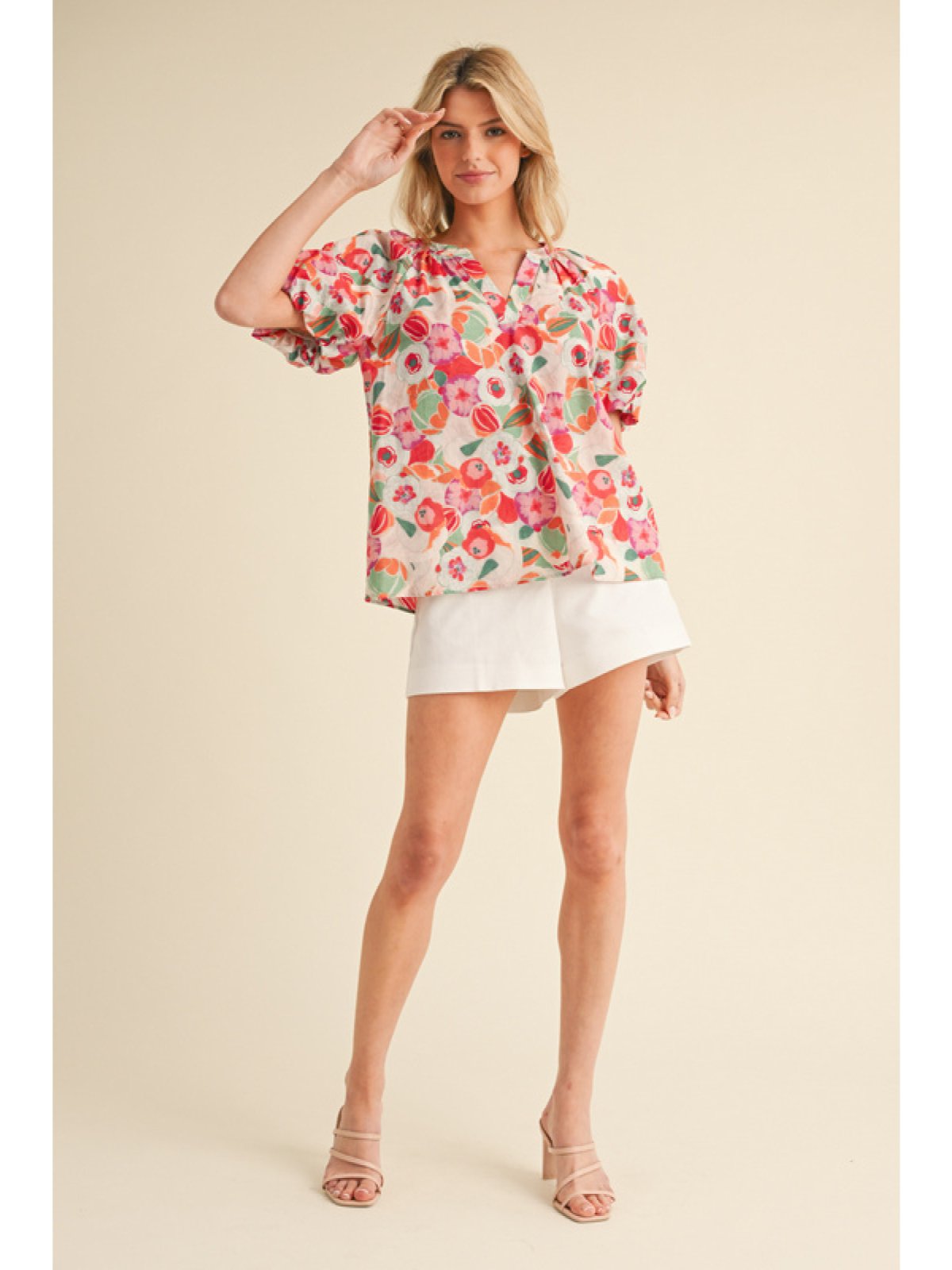 Joy Top featuring vibrant floral print, perfect for coastal boutique clothing and stylish pairings with shorts or skirts.
