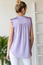 Back view of a woman wearing a LAVENDER SATIN TOP showcasing trendy coastal style from Raggdoll Boutique.