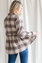 Stylish woman wearing a PLAID BABYDOLL FLANNEL TOP, perfect for trendy coastal style from Raggdoll Boutique.