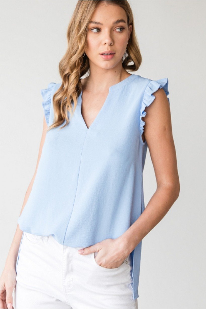 SKY BLUE TOP from Raggdoll Boutique features ruffle shoulders, perfect for summer outfits Texas.