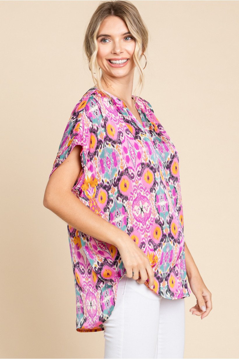 Stylish woman wearing ORCHID MIX TOP from Raggdoll Boutique, showcasing trendy coastal style and summer outfits Texas.
