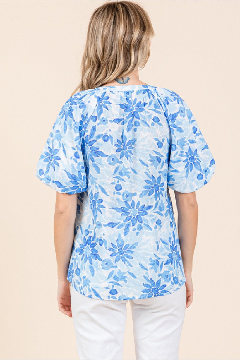 Back view of a Blue Floral Bubble Sleeve top from Raggdoll Boutique, perfect for summer outfits Texas.