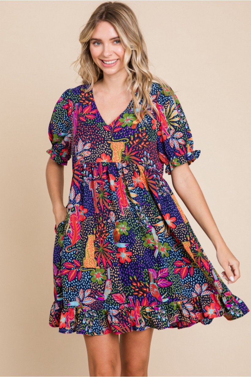 Laura Bell Dress from Raggdoll Boutique, featuring vibrant floral patterns, perfect for summer outfits in Port Aransas.