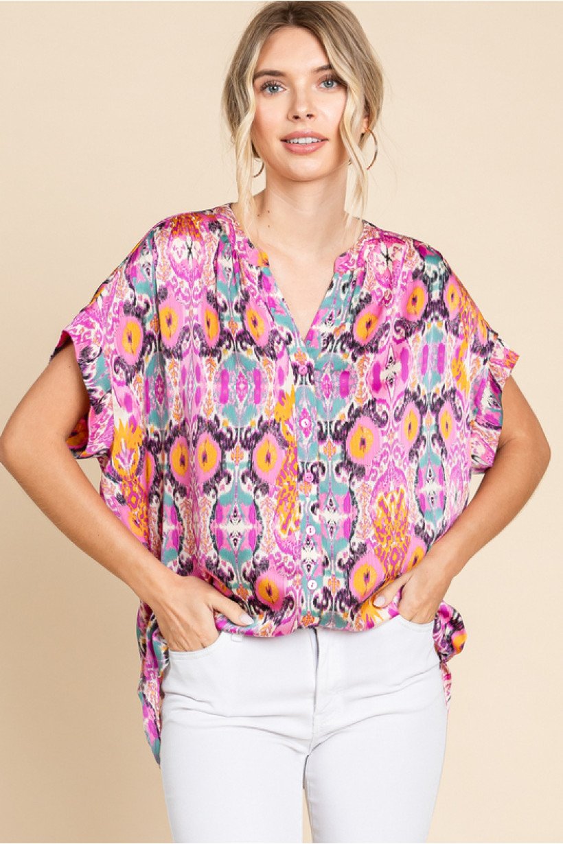 Model wearing ORCHID MIX TOP, a colorful boutique top from Raggdoll Boutique in Port Aransas.