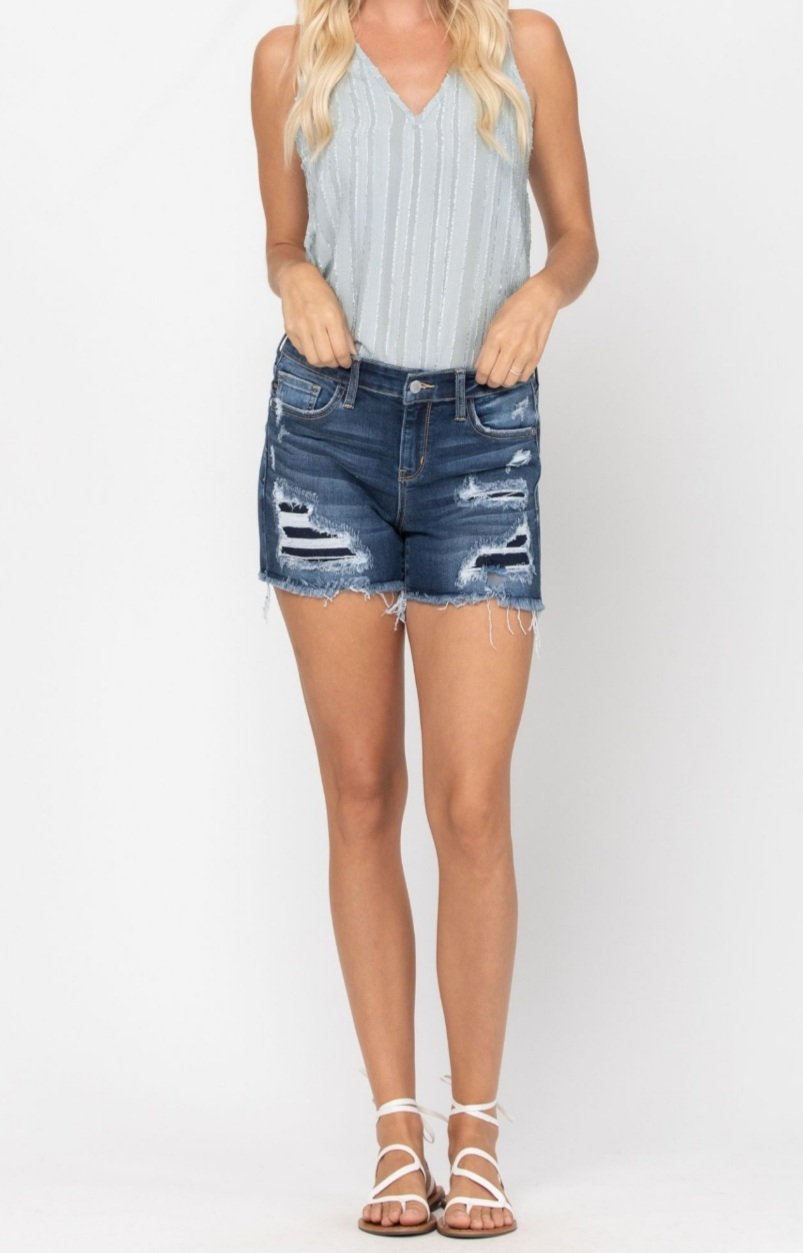 JUDY BLUE WASH-OUT PATCHED CUT-OFFS showcased with boutique top, perfect for summer outfits Texas from Raggdoll Boutique.