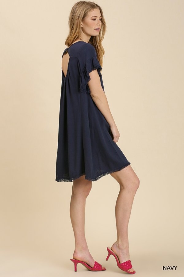 Navy dress with cut-out back detail, perfect for coastal boutique clothing and tropical vacations. Stylish addition to any wardrobe.