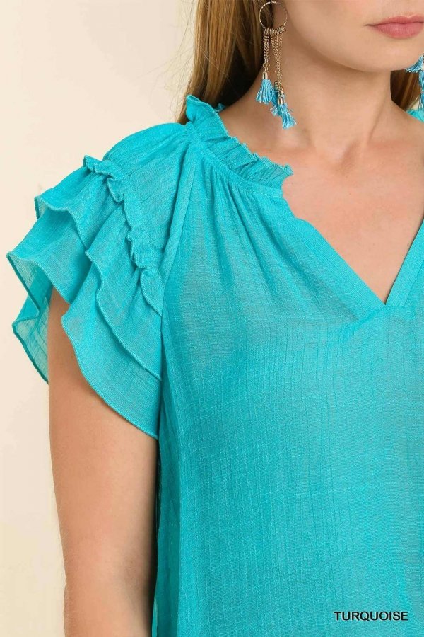 Stylish TURQUOISE TOP from Raggdoll Boutique, perfect for summer outfits Texas and coastal fashion boutique.