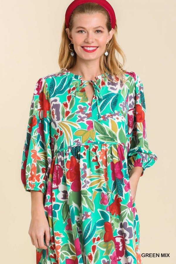 Stylish model wearing a GREEN MULTI DRESS from Raggdoll Boutique, perfect for trendy coastal style and summer outfits Texas.