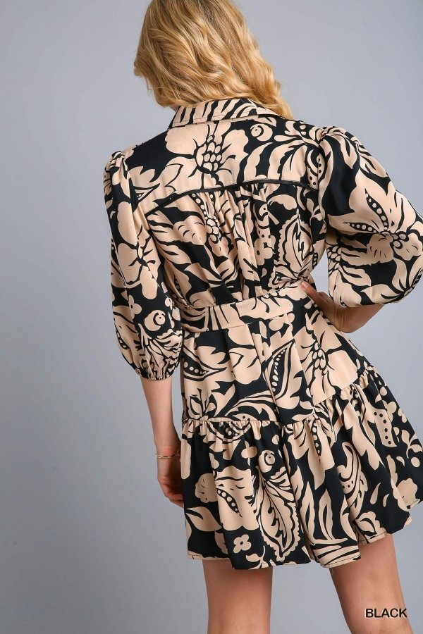 SHE'S TIMELESS DRESS showcasing a floral pattern, perfect summer outfit from Raggdoll Boutique in Port Aransas.