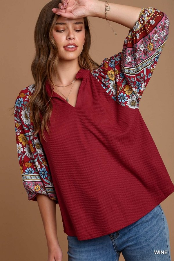 WINE AND FLORALS TOP from Raggdoll Boutique, featured in trendy coastal style with floral sleeves.