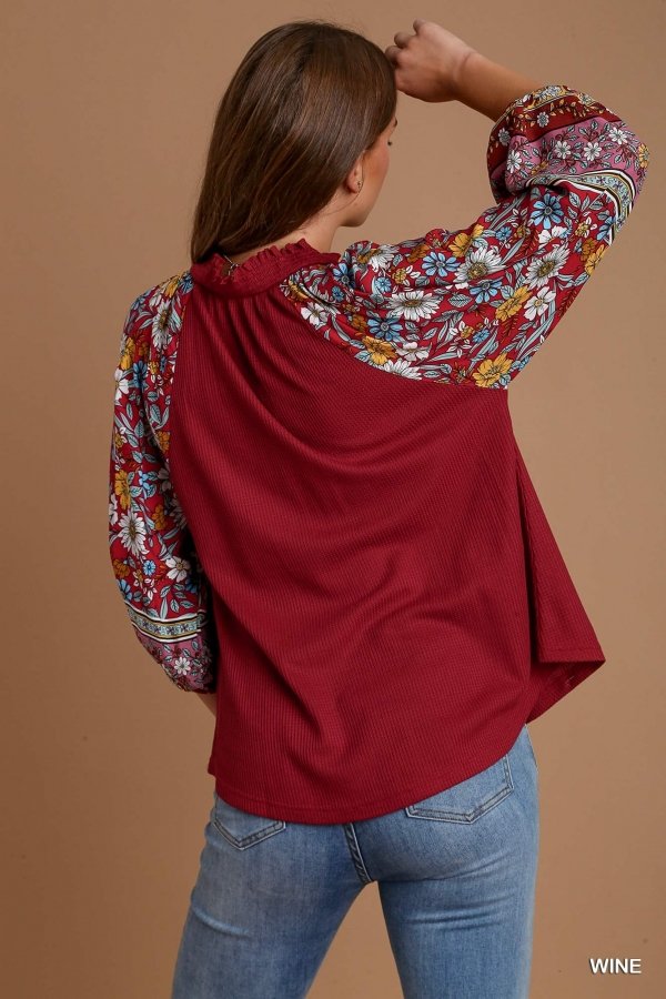 WINE AND FLORALS TOP featuring vibrant floral sleeves, a trendy coastal style from Raggdoll Boutique.