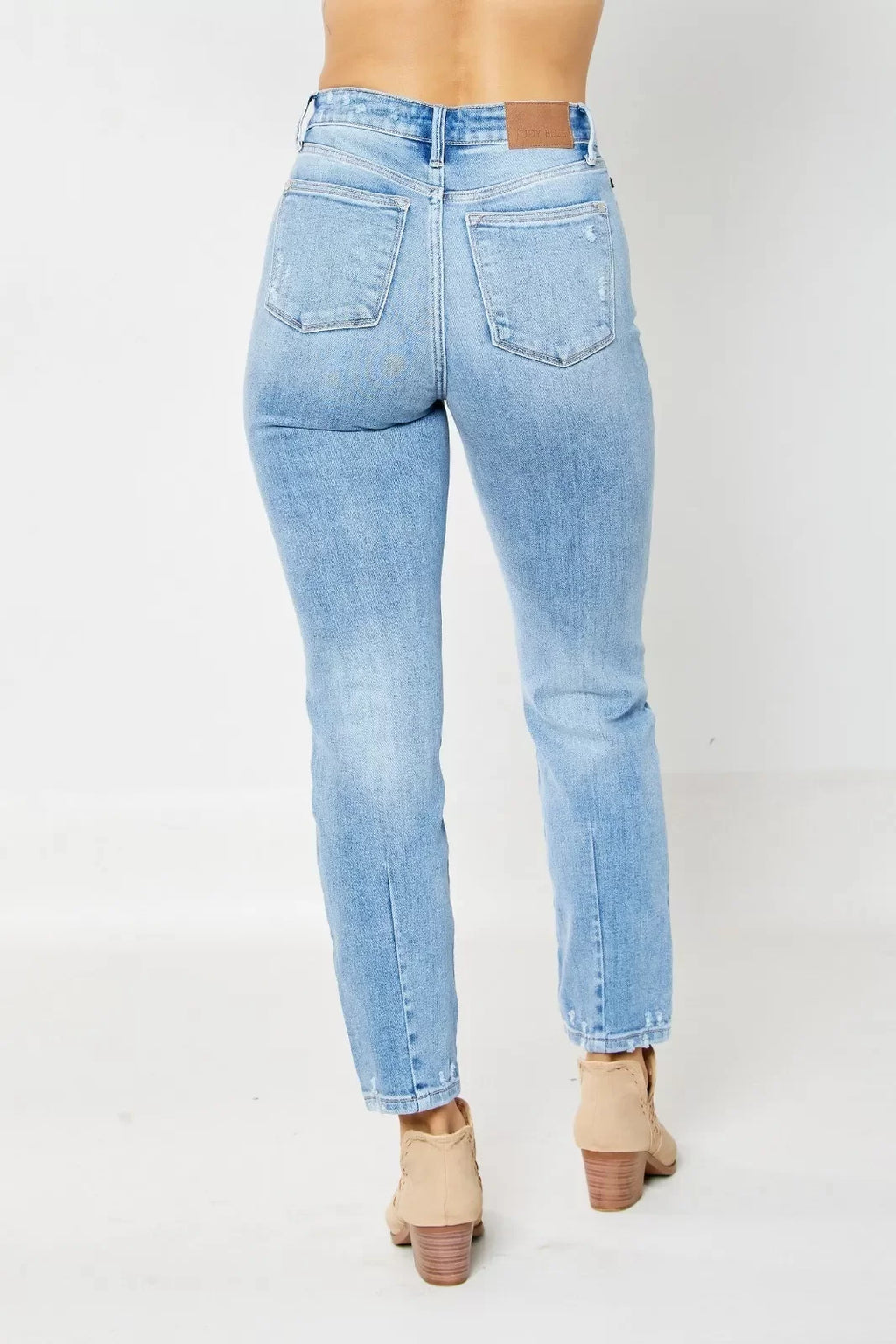 JUDY BLUE HW DESTROY & BACK HEM DART SLIM JEAN shown in back view, perfect for trendy coastal style at Raggdoll Boutique.