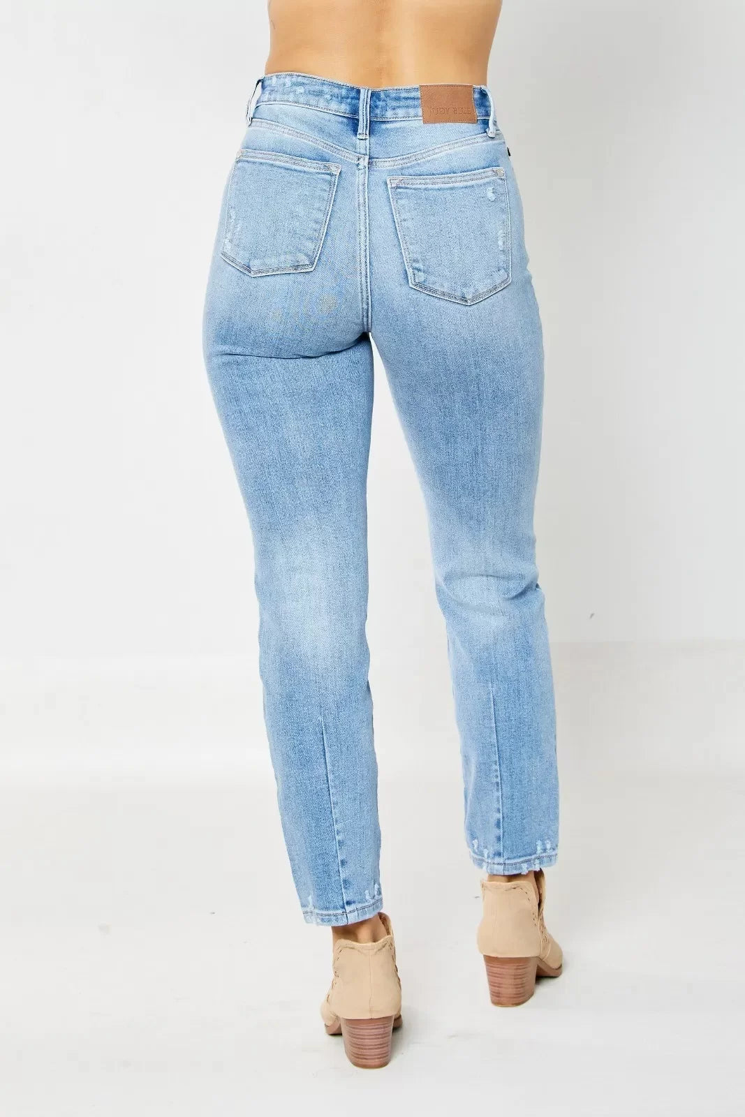 JUDY BLUE HW DESTROY & BACK HEM DART SLIM JEAN shown in back view, perfect for trendy coastal style at Raggdoll Boutique.