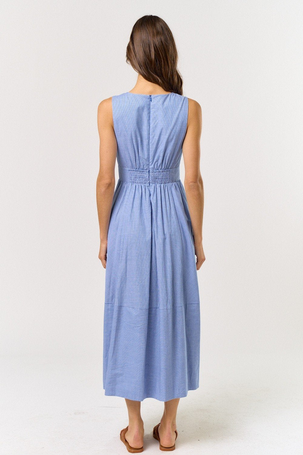 Back view of the Blue & White Sleeveless V-Neck Midi Dress, ideal for coastal boutique clothing and beach dresses.