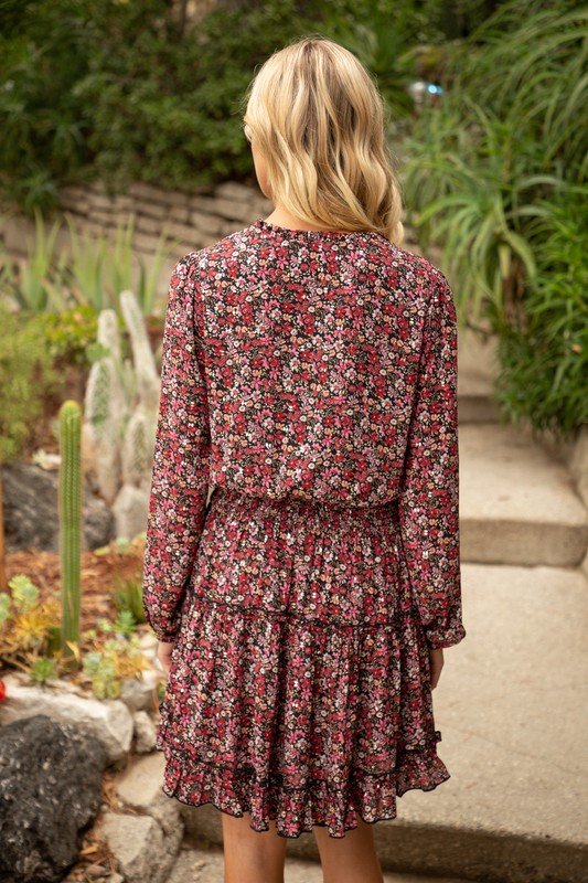 Back view of a burgundy ruffle skirt golden floral dress from Raggdoll Boutique, ideal for summer outfits Texas.