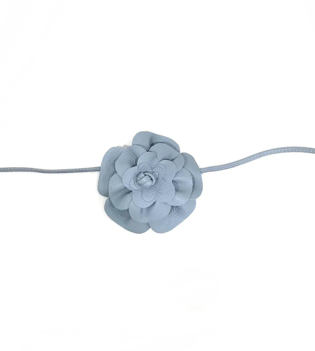 Flora leather belt in light blue with flower detail, perfect for coastal boutique clothing and tropical vacation dresses.
