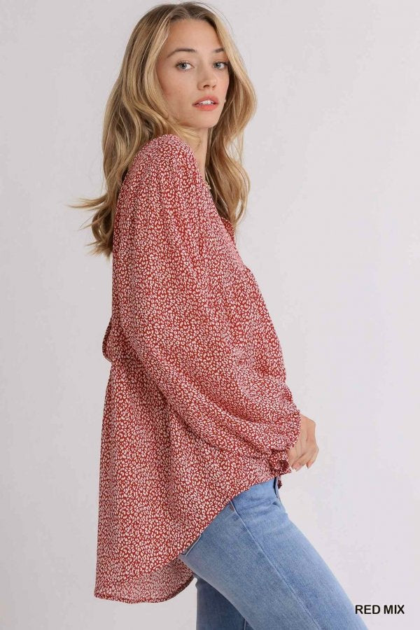 Model wearing a stylish RED MIX ANIMAL PRINT TOP from Raggdoll Boutique, perfect for trendy coastal style and summer outfits.