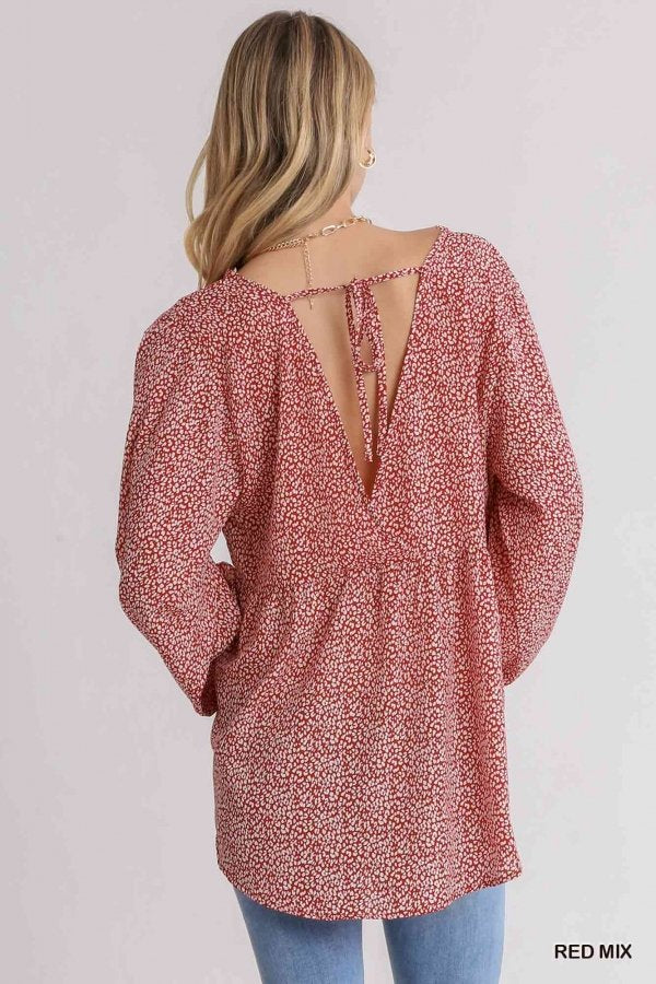 Back view of a model wearing a RED MIX ANIMAL PRINT TOP from Raggdoll Boutique, perfect for trendy coastal style.