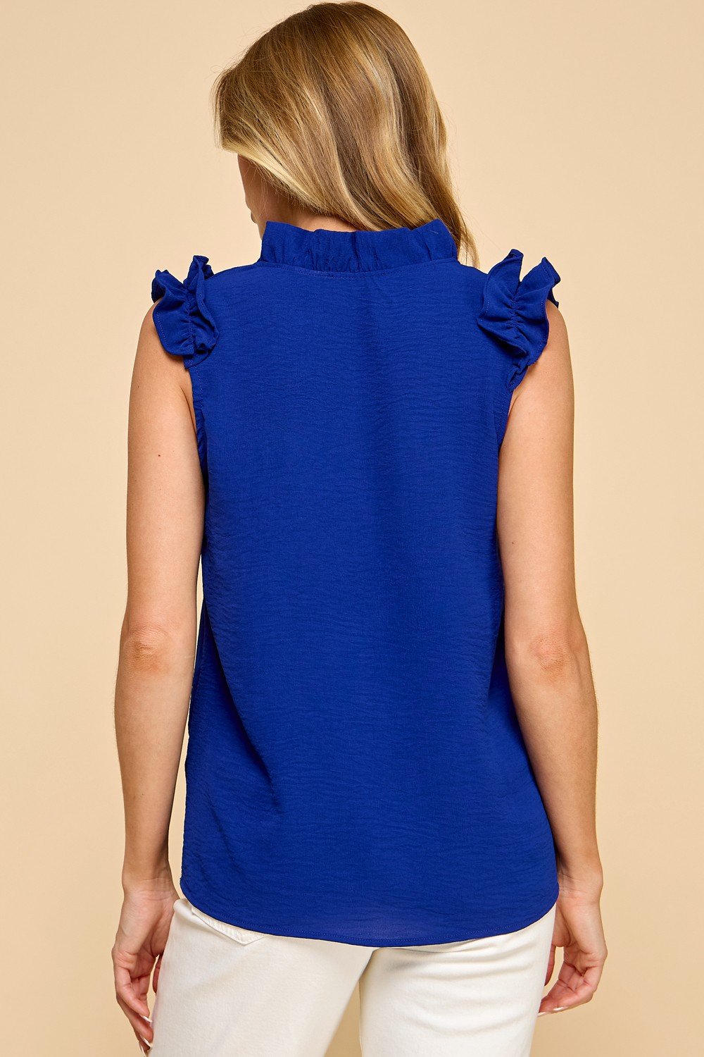 Elegant blue women's top with ruffled sleeves, perfect for coastal boutique clothing and casual outings.
